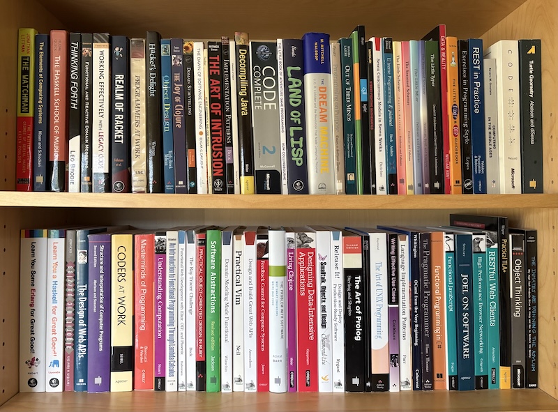 A picture of my bookshelf with various software books.